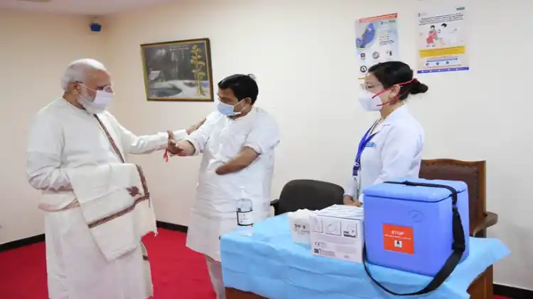 Prime Minister Narendra Modi interacting with healthcare workers at AIIMS  as India administered 100 crore vaccinations against COVID-19