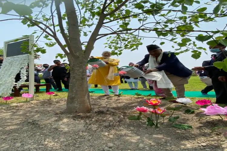 Prime Minister Narendra Modi planting a tree a Lumbini, Nepal