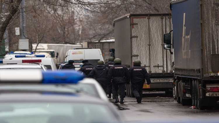 Policemen work at the site of a shooting in Moscow