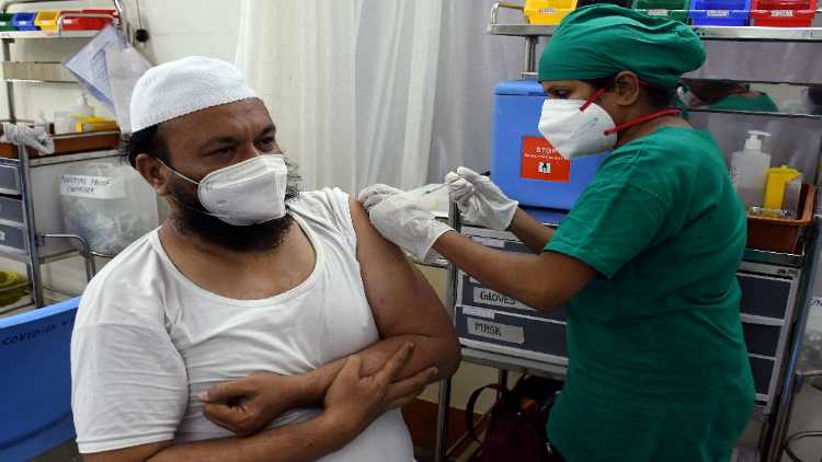A man receiving the COVID vaccine in Mumbai
