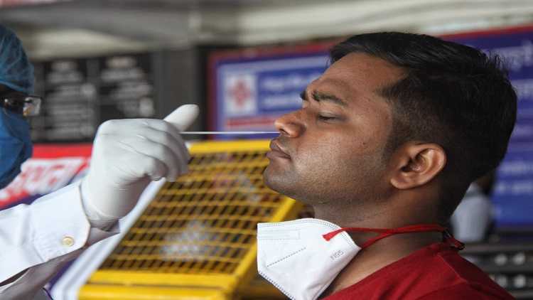 Health worker collect swab sample for Covid-19 testing