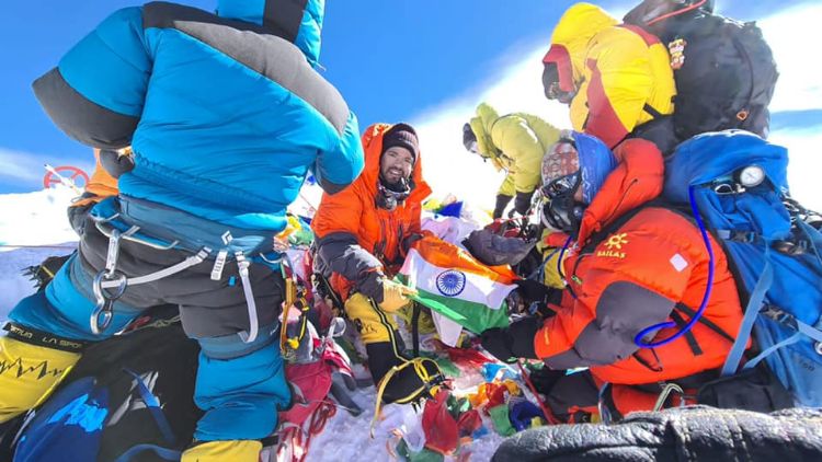 Akash (in the centre) after scaling summit