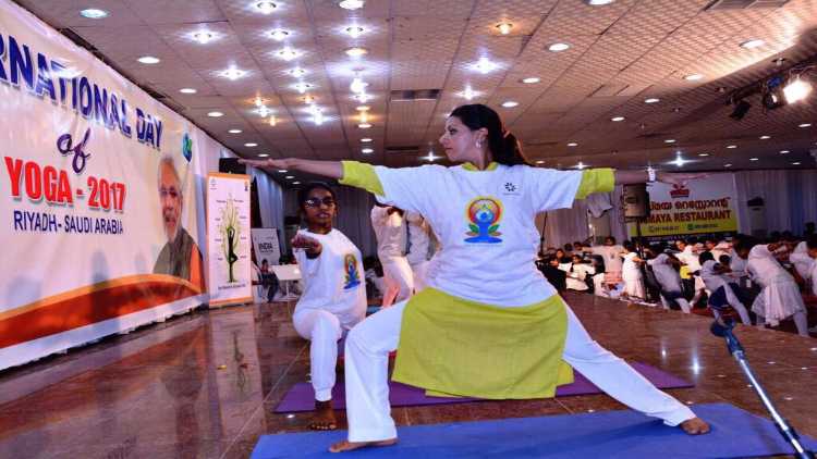 Nouf Marwaai leading session on Yoga on International Yoga Day