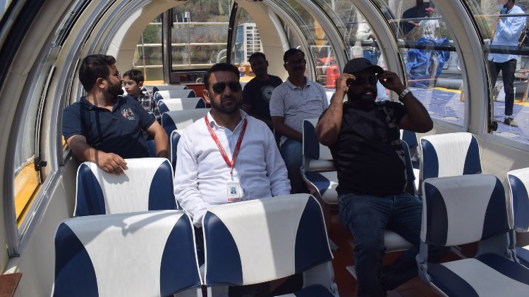 Passengers taking their first ride in bus boat in Jhelum (Basit Zargar)