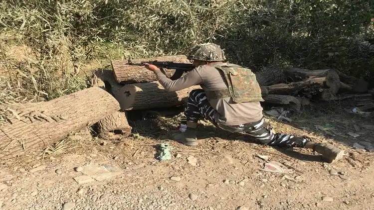 A soldier takes position during an encounter between terrorists
