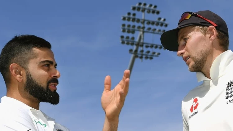 Virat Kohli with a member of the England team

