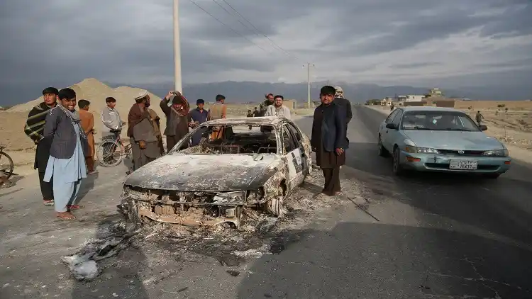 People gather at the site of an attack near the Bagram Air Base