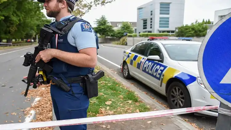 A policeman stands guard near the scene of the attacks in New Zealand