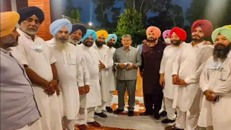 Punjab CM Designate Charanjit Singh Channi with Punjab Congress President Navjot Sidhu and senior party leader Harish Rawat