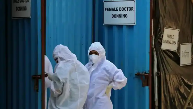 Health workers wearing PPE suits