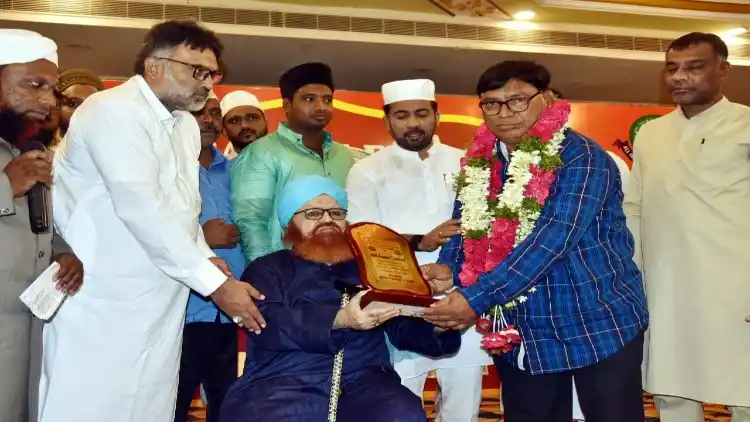 Anil Kumar Chauhan receiving the award