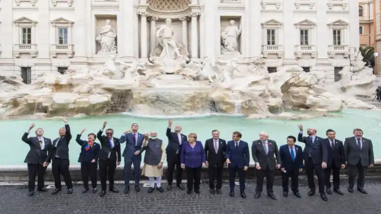 Prime Minister Narendra Modi and other leaders attending G-20 summit in Rome toss a coin in Rome's Trevi fountain