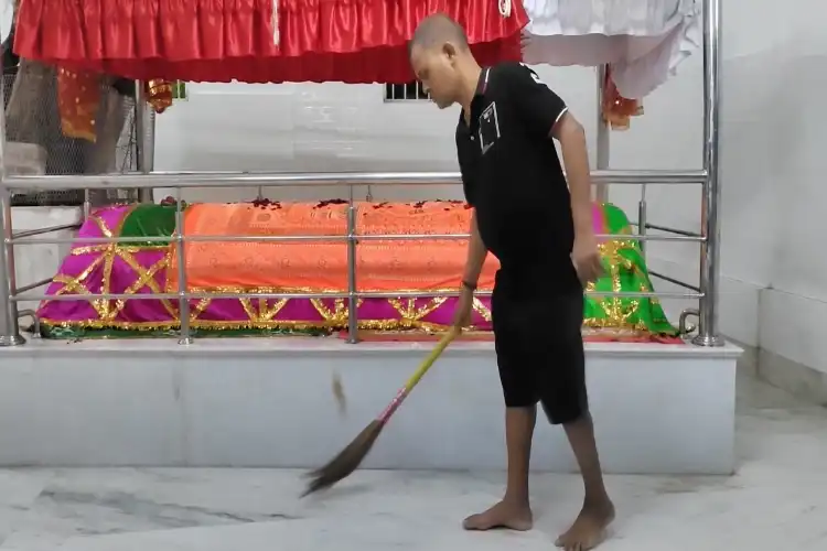 Ghose cleaning the shrine