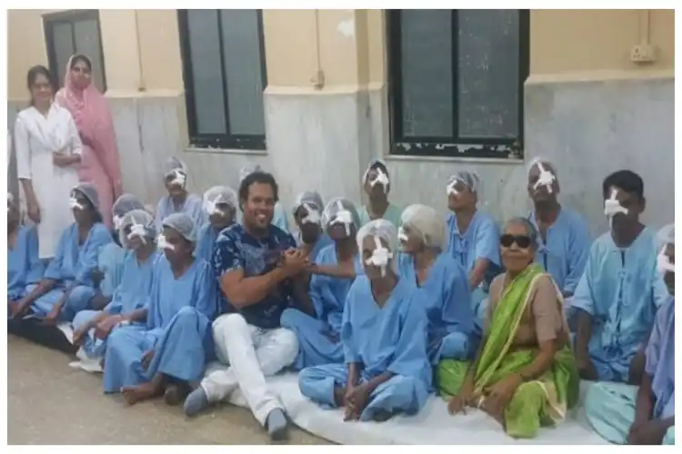 Saquib Gore with a group of women who have undergone surgery for removal of cataracts