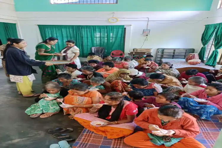 Inmates being served food at Jyoti Griha in Nazira.
