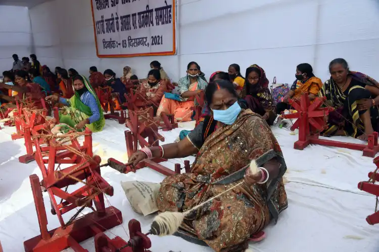 Women spinning charkha