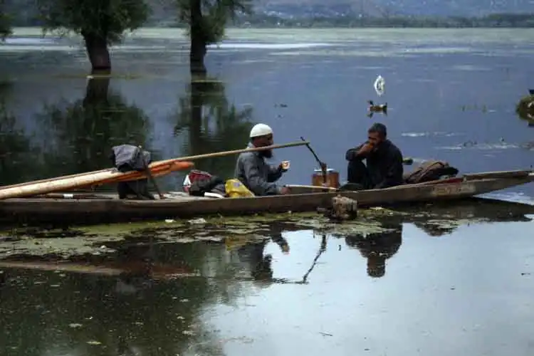 Locals out on fishing in Wular Lake