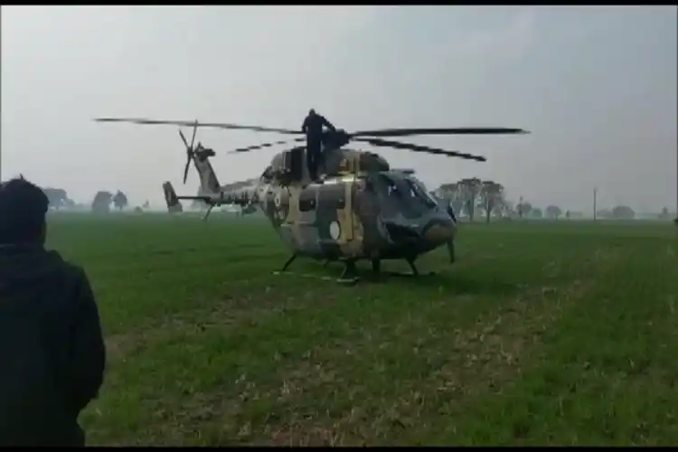 The stricken helicopter being repaired.