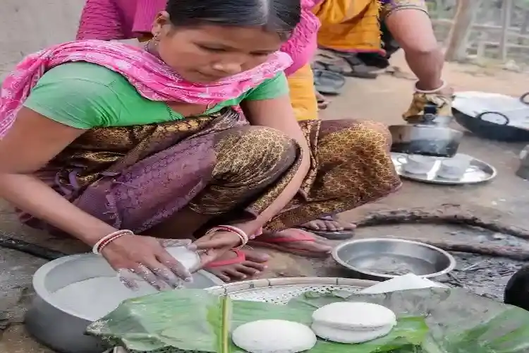 Women preparing traditional foods on Bihu