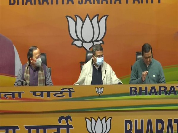 Union Minister Dharmendra Pradhan (centre) at the BJP press conference. 