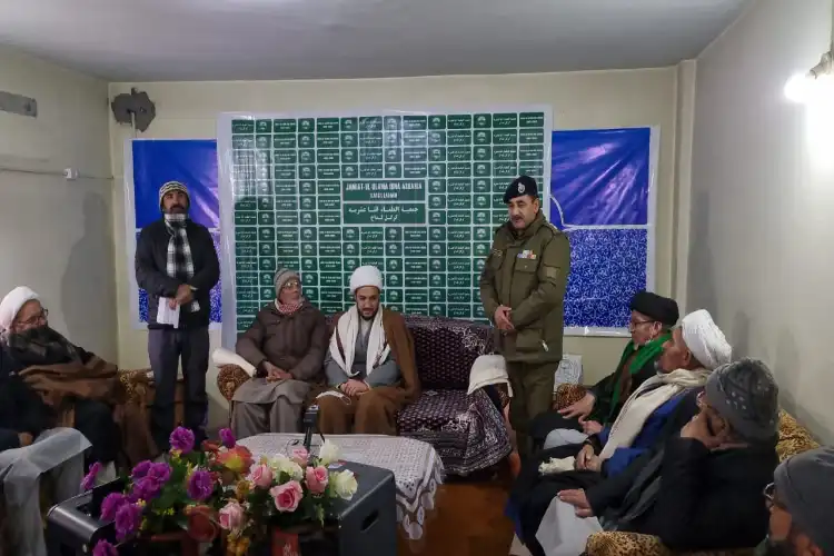 Akhone Asgar Ali Basharat (Sitting on the left) and DySP Mohammad Aslam Mir being felicitated at Kargil