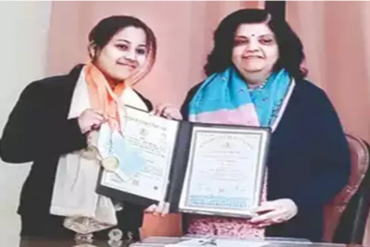 Ghazala receiving medals at University