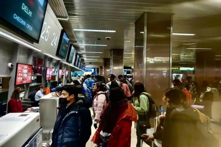 Indians at Bucharest airport before boarding an evacuation flight.