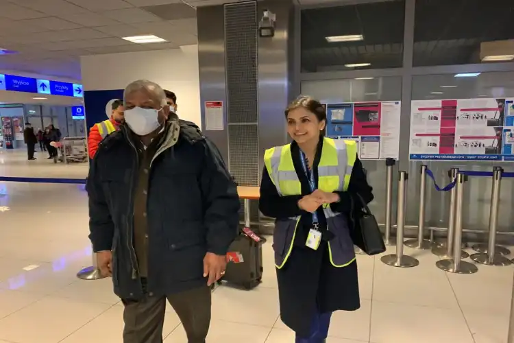 Ambassador Nagma Mallick with Minister gen (retd) V K Singh at a Polish airport