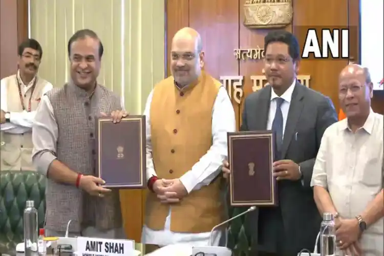 Assam CM Himanta Sarma and Meghalaya CM Conrad Sangma with Union Home Minister Amit Shah after signing a border agreement.er