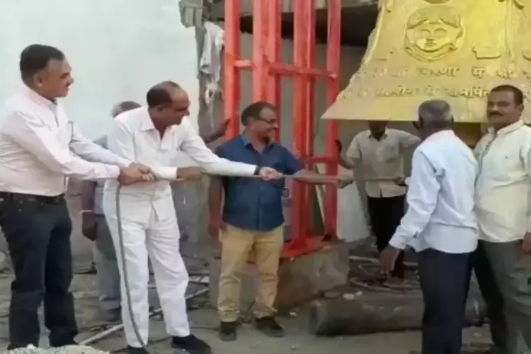 District Magistrate and others ringing the Mahaghanta