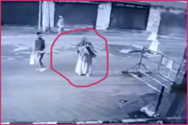 Video grab of woman who threw petrol bomb