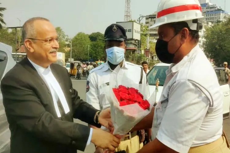 Chief Justice Satish Chander Sharna presenting a bouquet to Ashraf Ali