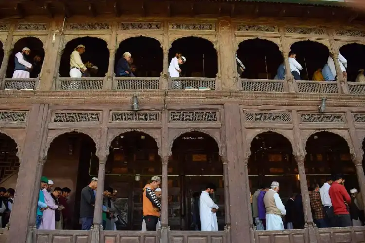 People offering Namaz in a heritage mosque in Srinagar