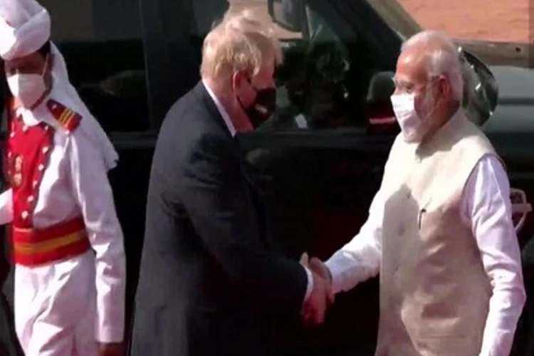 Prime Minister Narendra Modi shaking hands with UK Prime Minister Boris Johnson