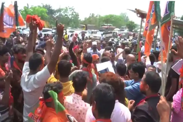 BJP supporters celebrate the victory in the GMC election.