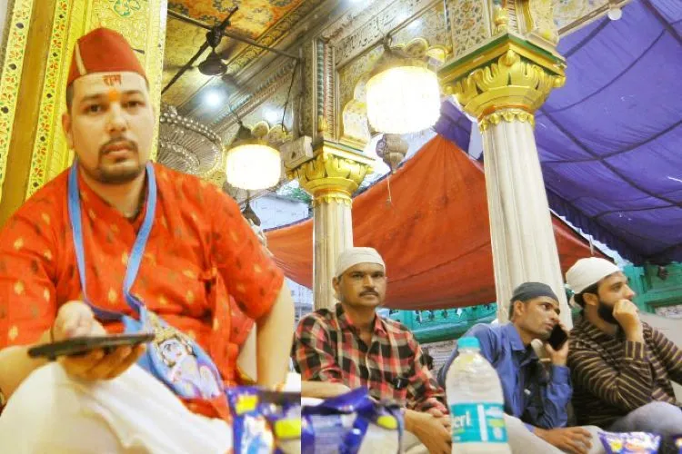 A Hindu devotee sitting with others in Nizamuddin dargah 