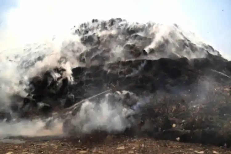 The Bhalswa landfill has been belching smoke after it caught fire on Tuesday.