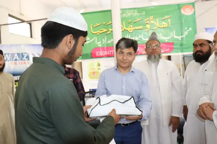 Awaz-the Voice Editor-in-Chief Atir Khan distributing gifts