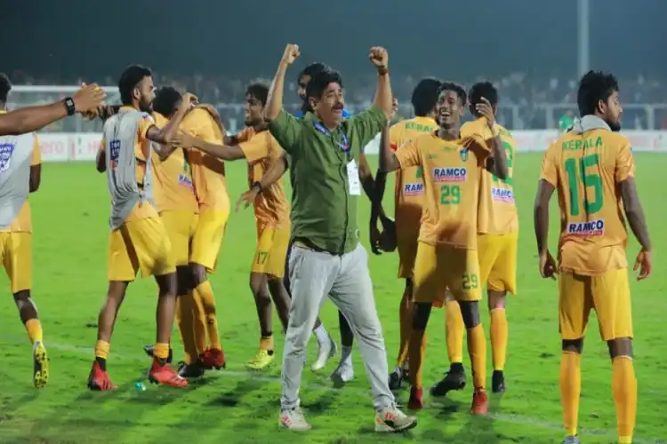 Kerala coach and players after the win