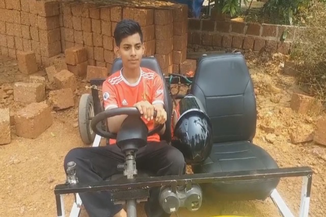 Irfan riding the car he made in 20 days
