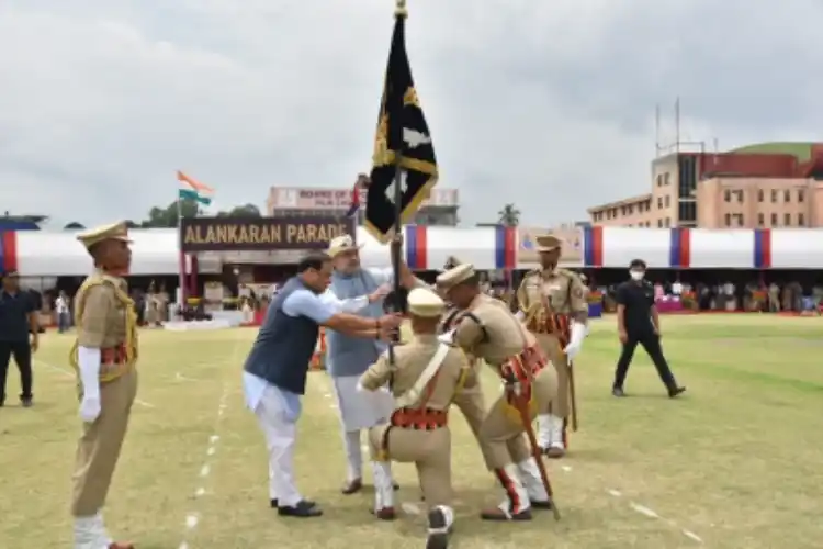 Union Home Minister Amit Shah presenting President's Colours to the Assam Police in Guwahati on Tuesday.