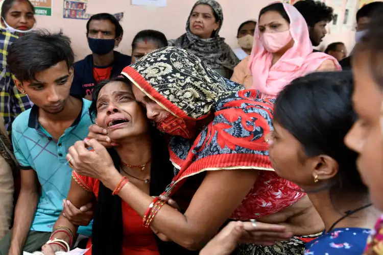 A worried family member of a missing person being consoled