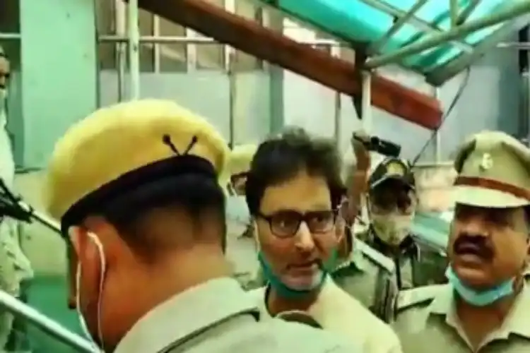 Yasin Malik being led away from the Court