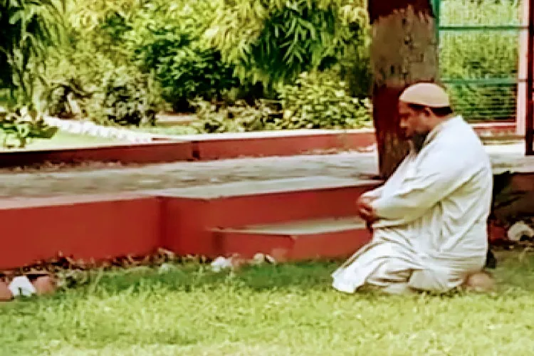 Prof Shah Raza Khalid praying in college ground