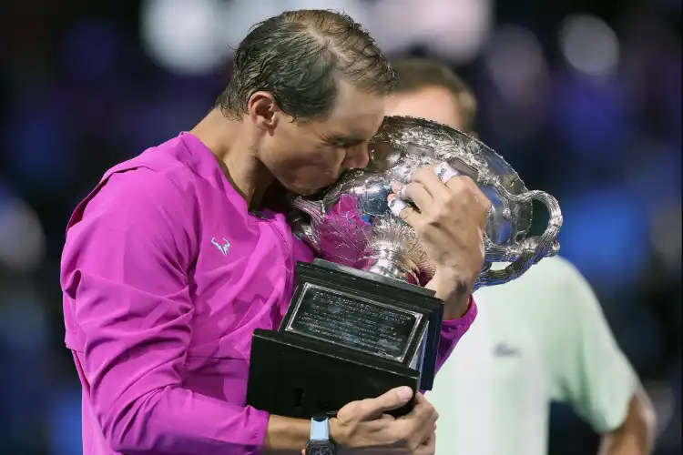 Rafael Nadal kissing the trophy