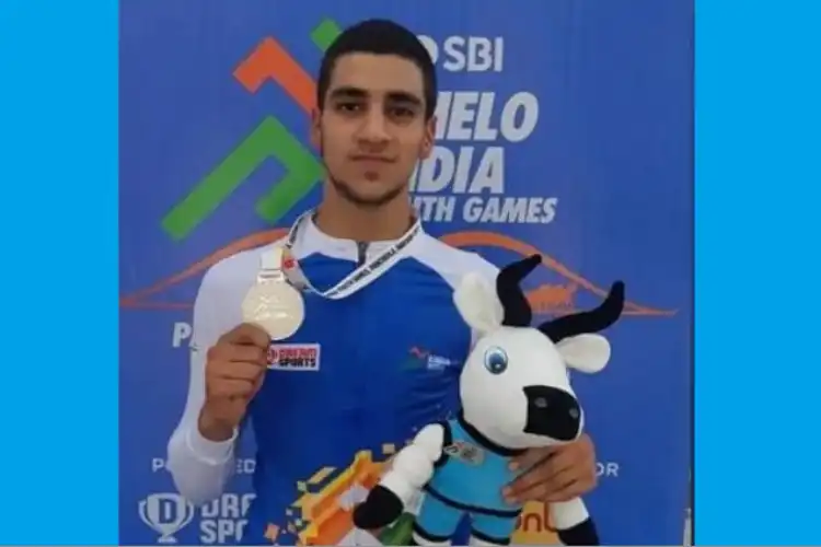Adil Altaf displaying his medal
