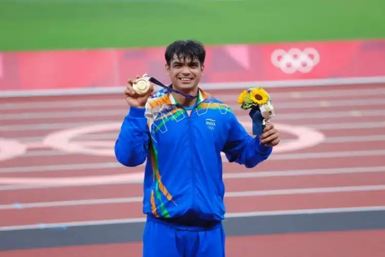 Neeraj Chopra displaying his gold