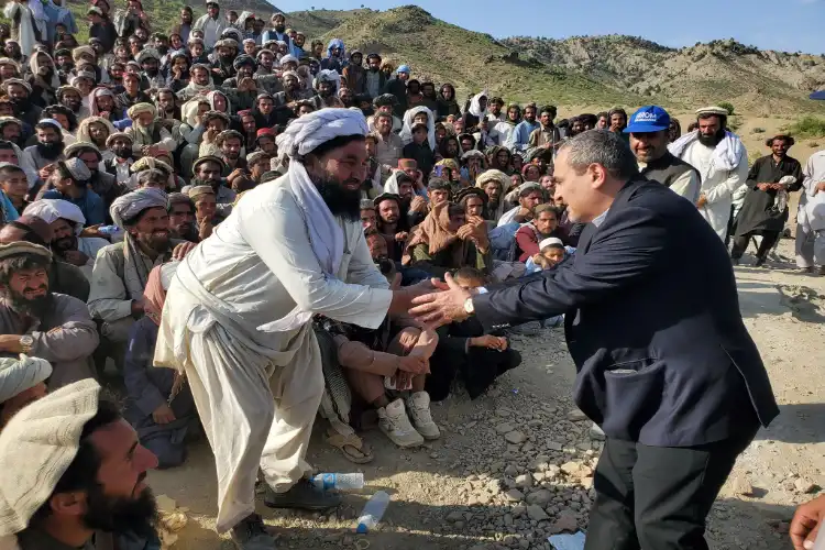UN official while distributing aid in earthquake affected villages in Afghanistan (Twitter)