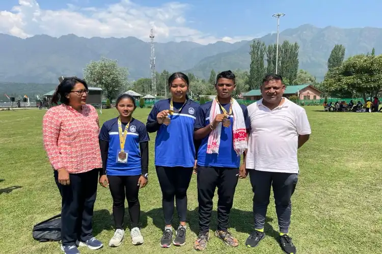 Farhan Ali with other medalists from Assam and his parents in Srinagar