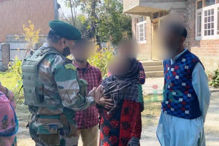 Parents of the surrendered militants (faces blurred) at the site of encounter (Twitter)